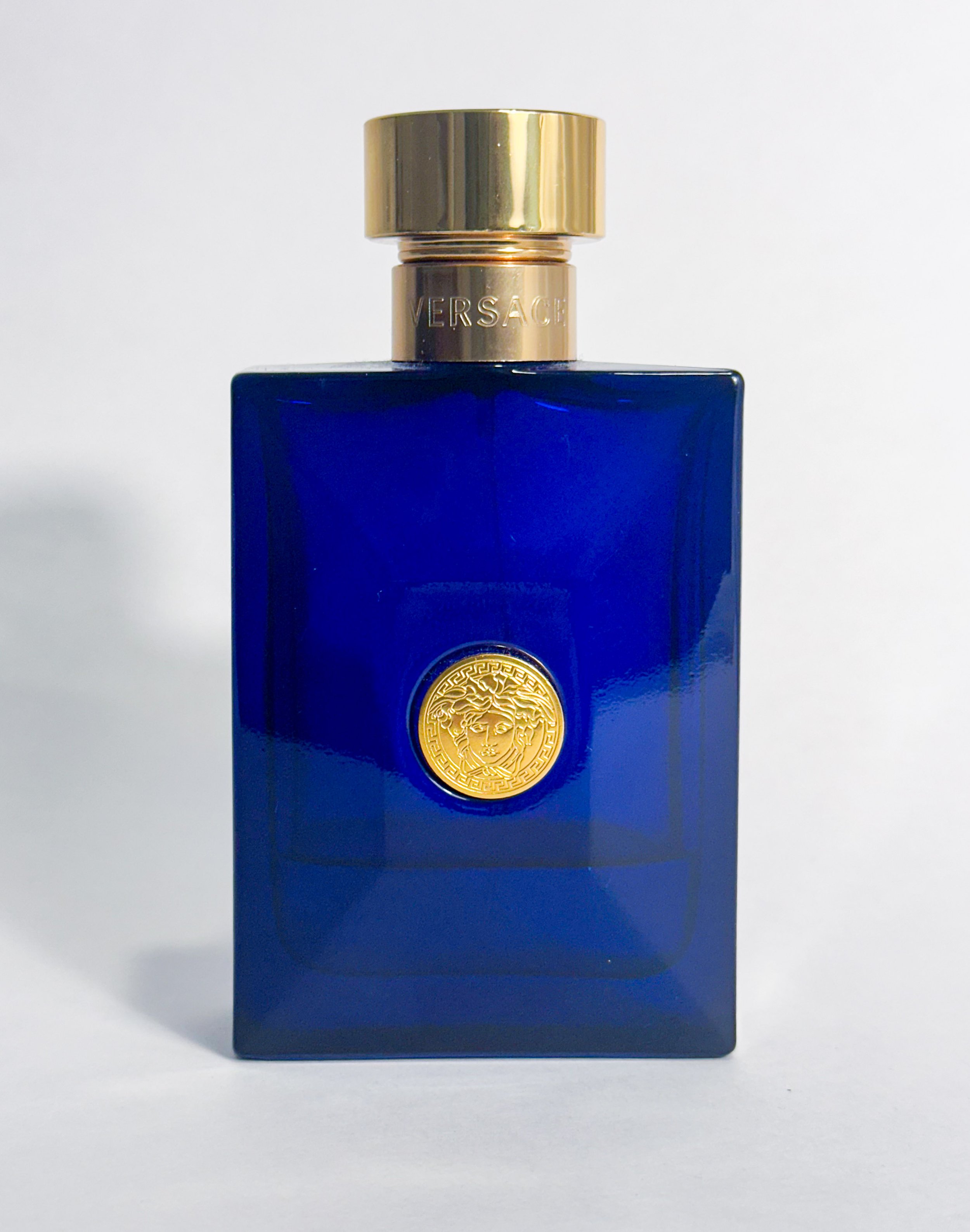 Image of a glass bottle of Versace's Dylan Blue men's cologne taken on 3/22/2026. This photo is as part of light box photo assignment at Penn State University.