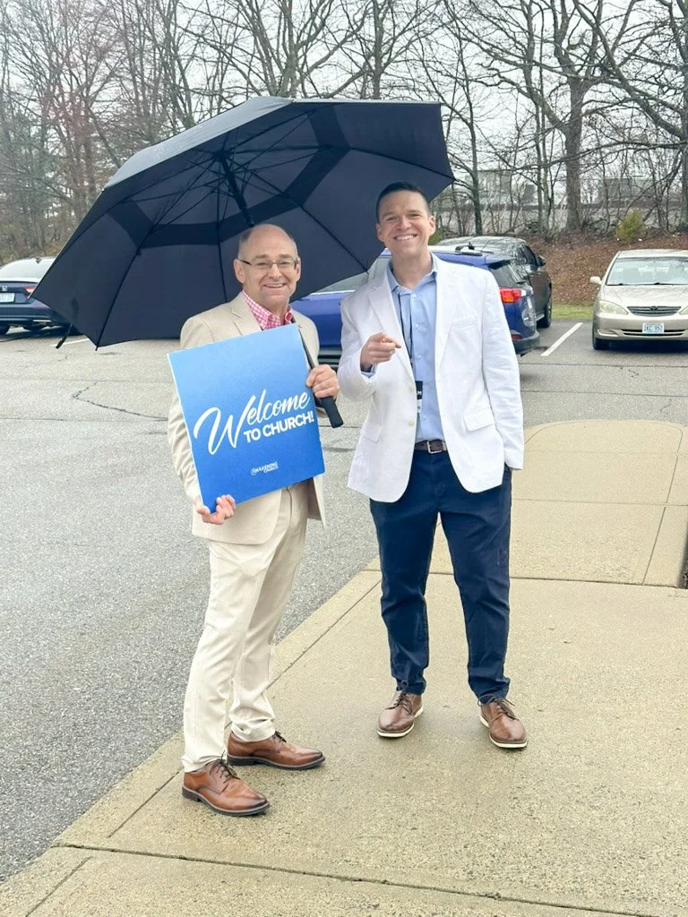 Taken 4.5.26 as church volunteers welcome guests to services, rain or shine. 