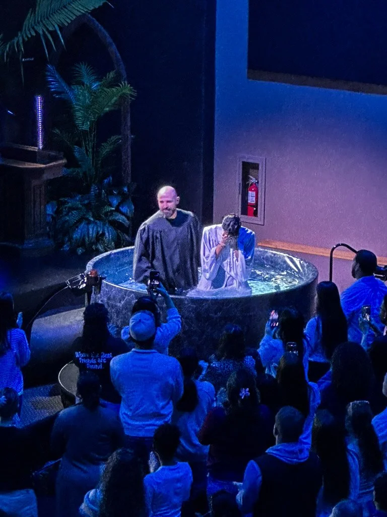 Taken 4.12.26 - images captures the emotional moment after a young man has been baptized in front of his family, friends, and church congregation. 