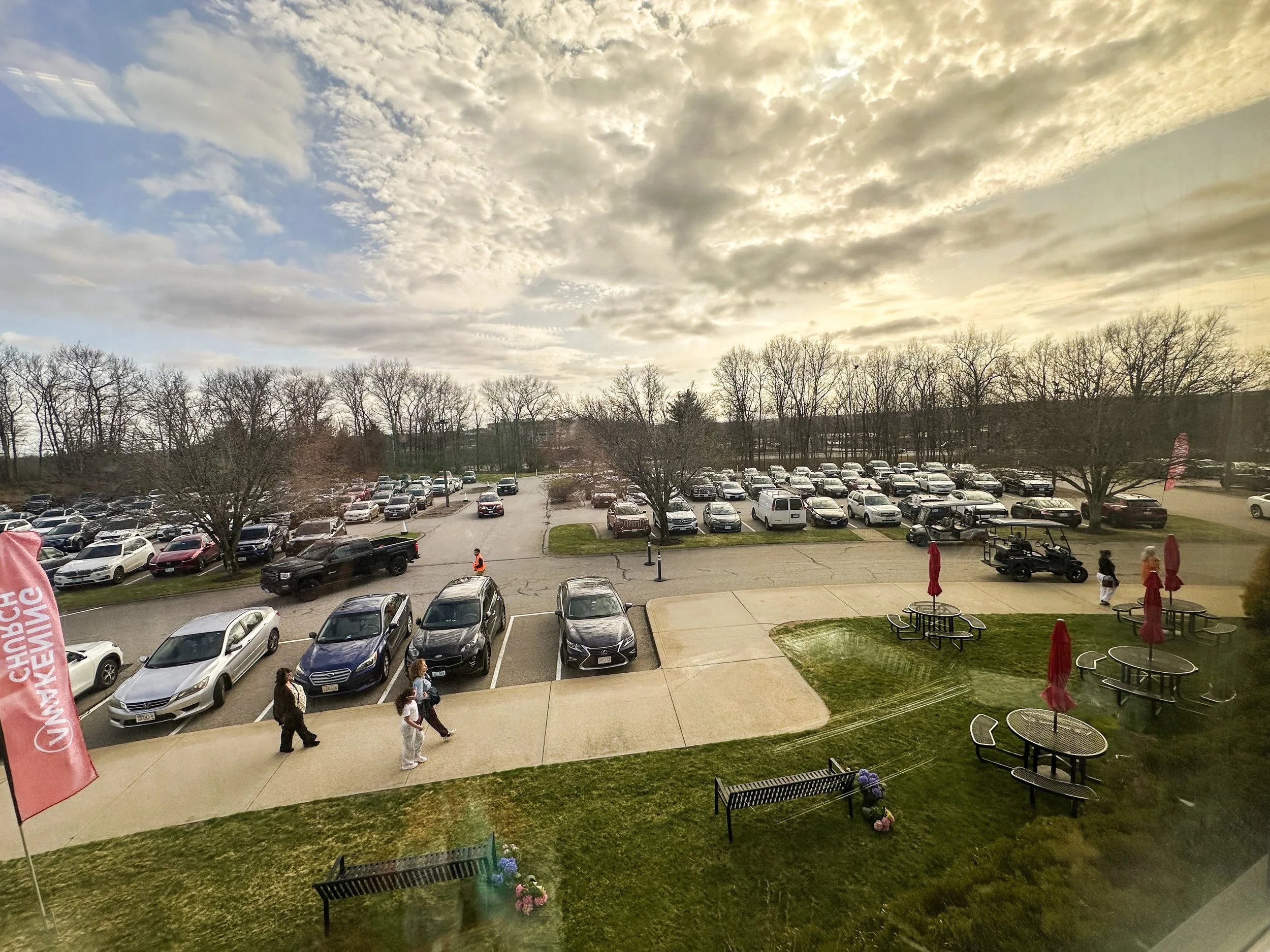 Taken 4.4.26 as the church parking lot fills with eager guests arriving to attend service. 