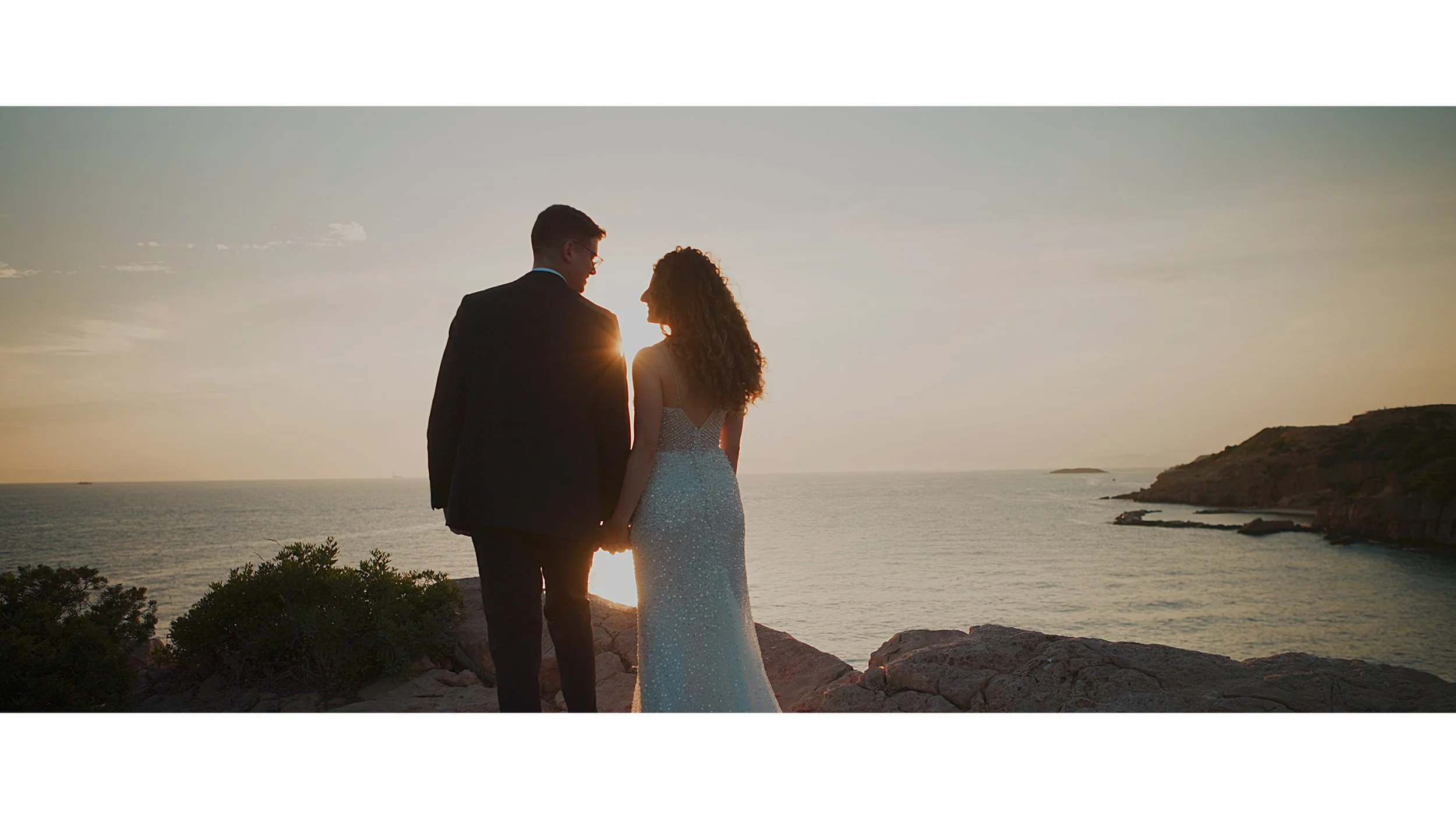 Newlywed couple walking together during their wedding day in Greece