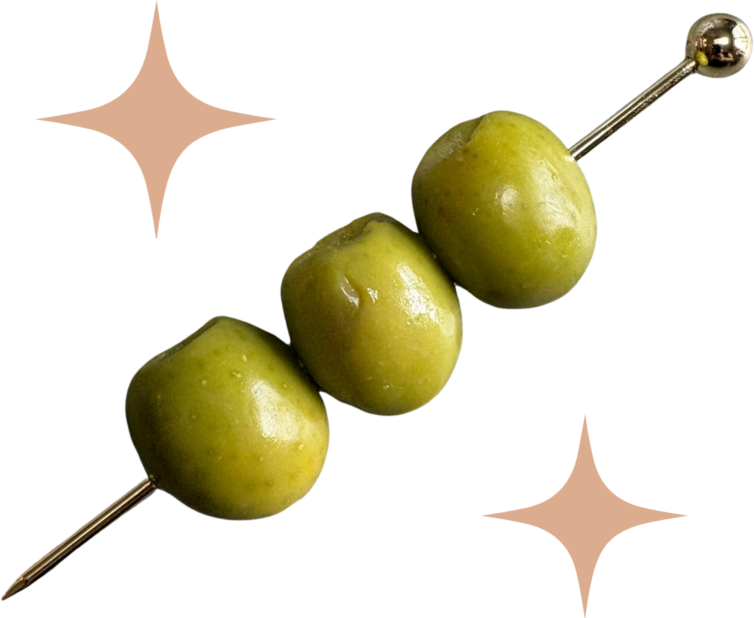Close-up of green olives on a gold metallic skewer.