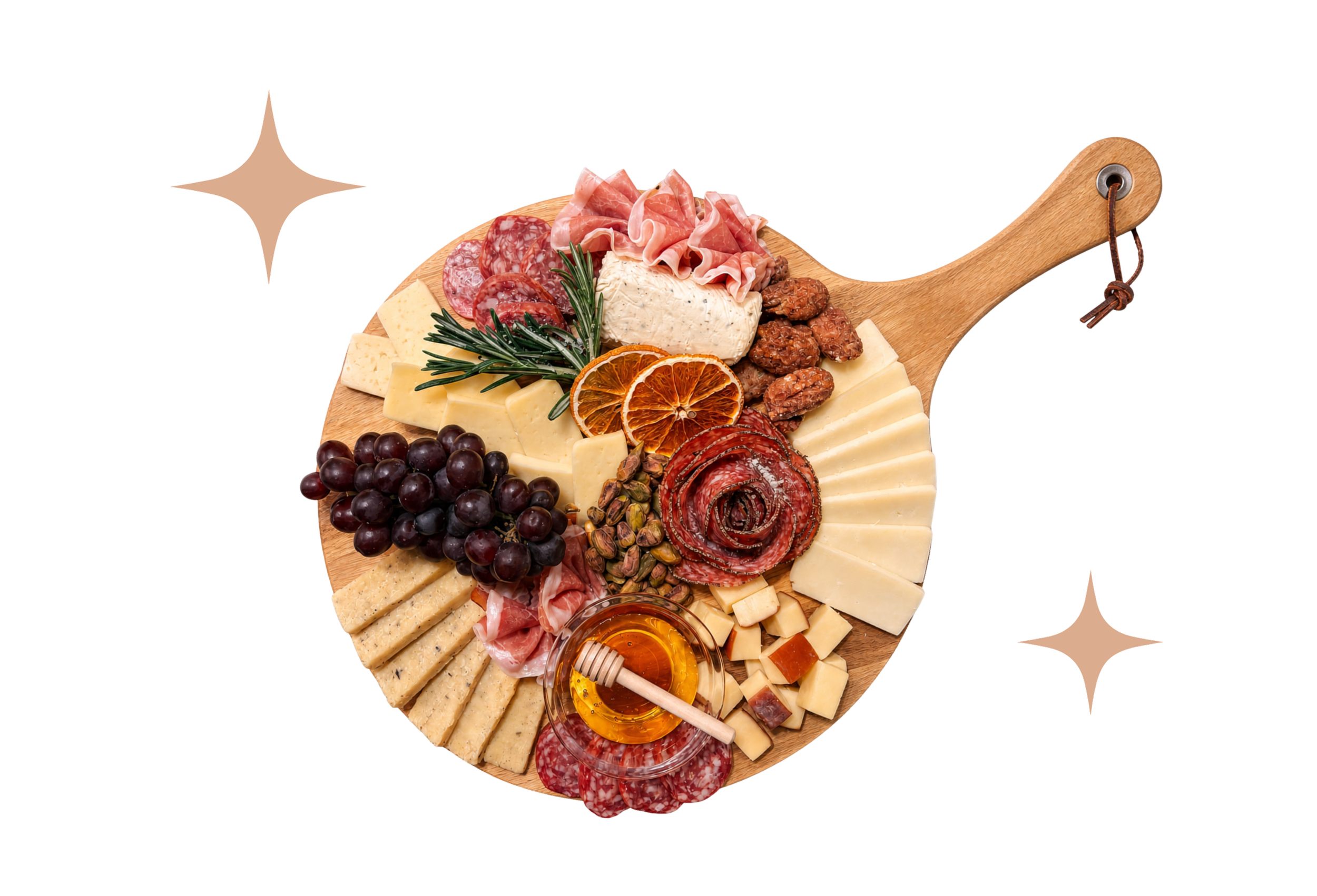 A round wooden cheese board with various cheeses, sliced meats, grapes, nuts, fresh herbs, dried oranges, honey, and crackers.