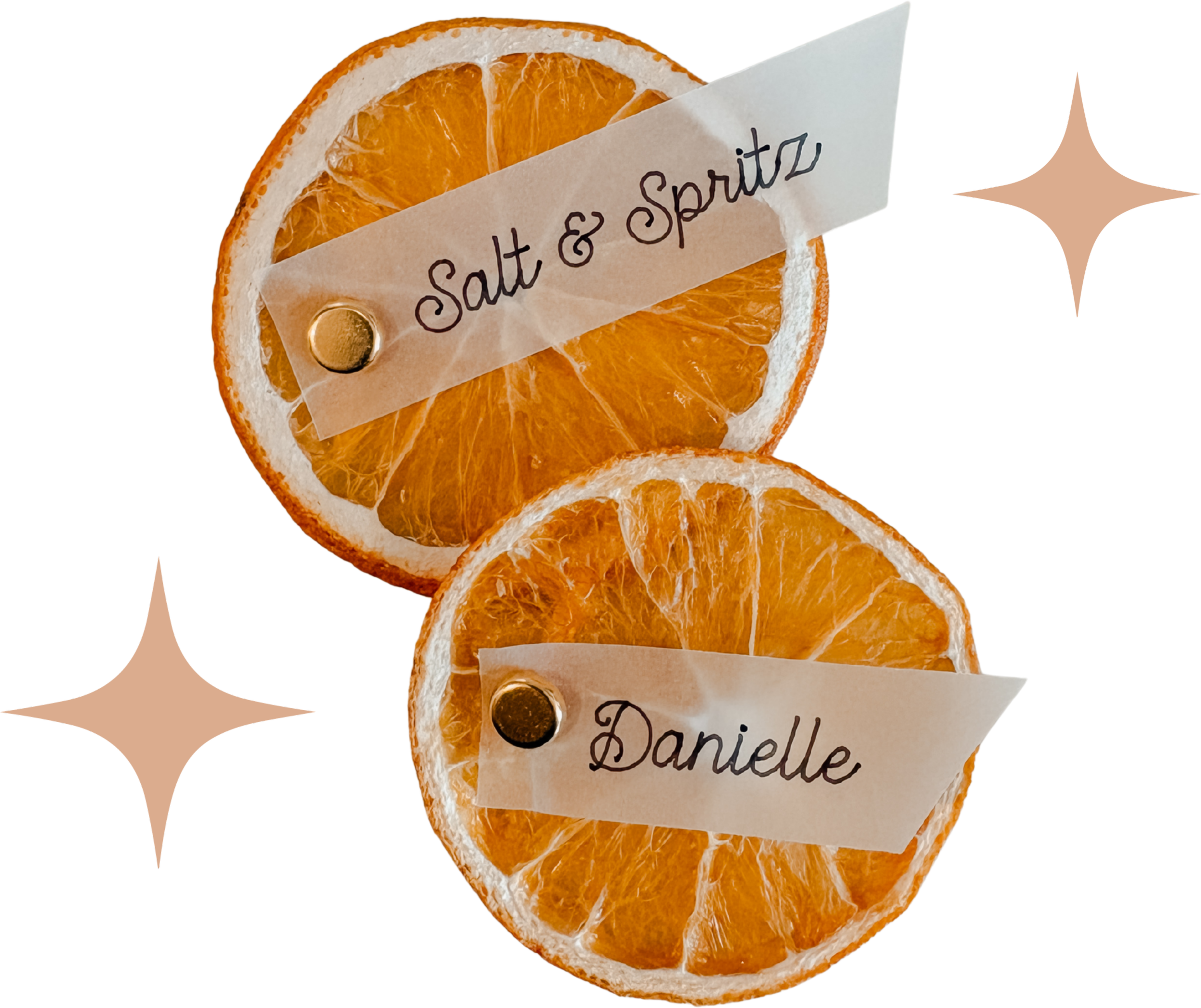 Several dried orange slices with a handwritten tag reading 'Salt & Spritz' attached to the top slice.
