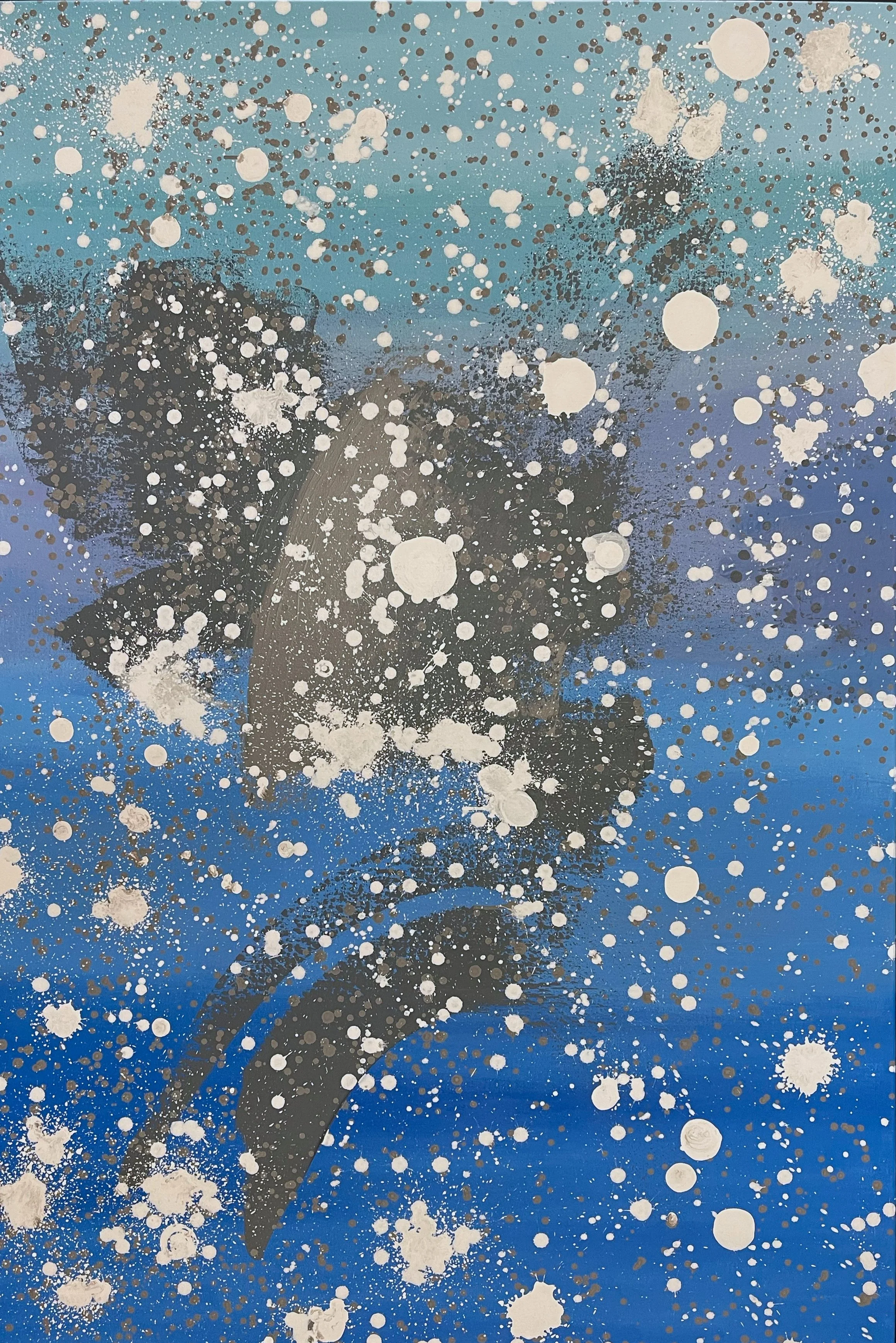 Abstract splatter painting with a blue background, black and white paint splashes, and circular spray patterns.