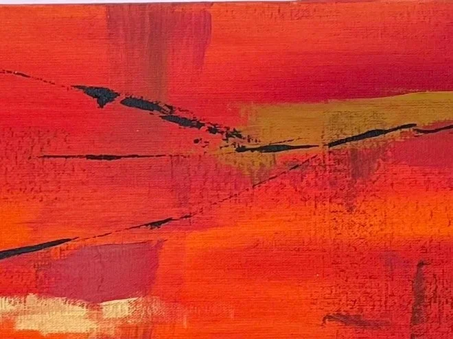 Abstract painting with red, orange, yellow, and black brush strokes.