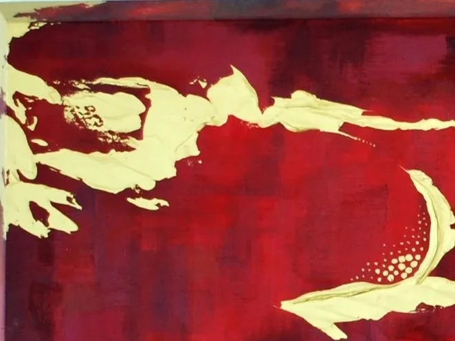 Abstract red and cream-colored mural with flowing shapes and dotted pattern.