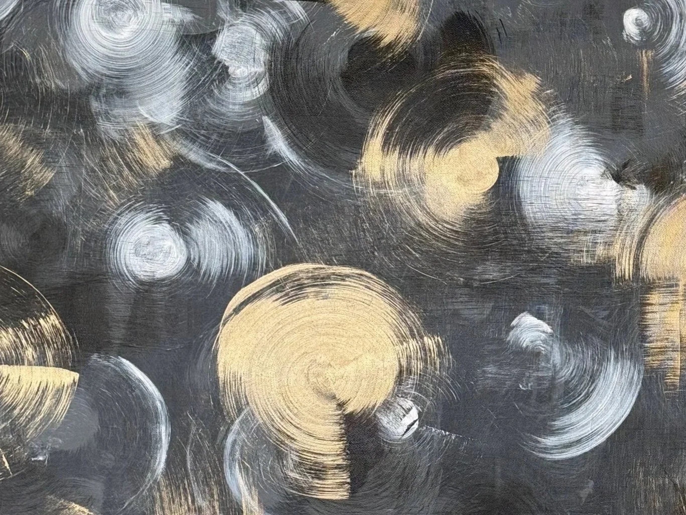 Abstract painting with overlapping circular brushstrokes in gold, white, and black on a textured dark background.
