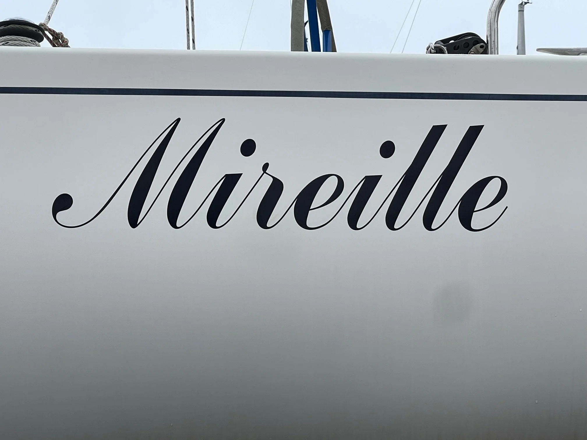 Classic cursive lettering style in a deep blue coloration