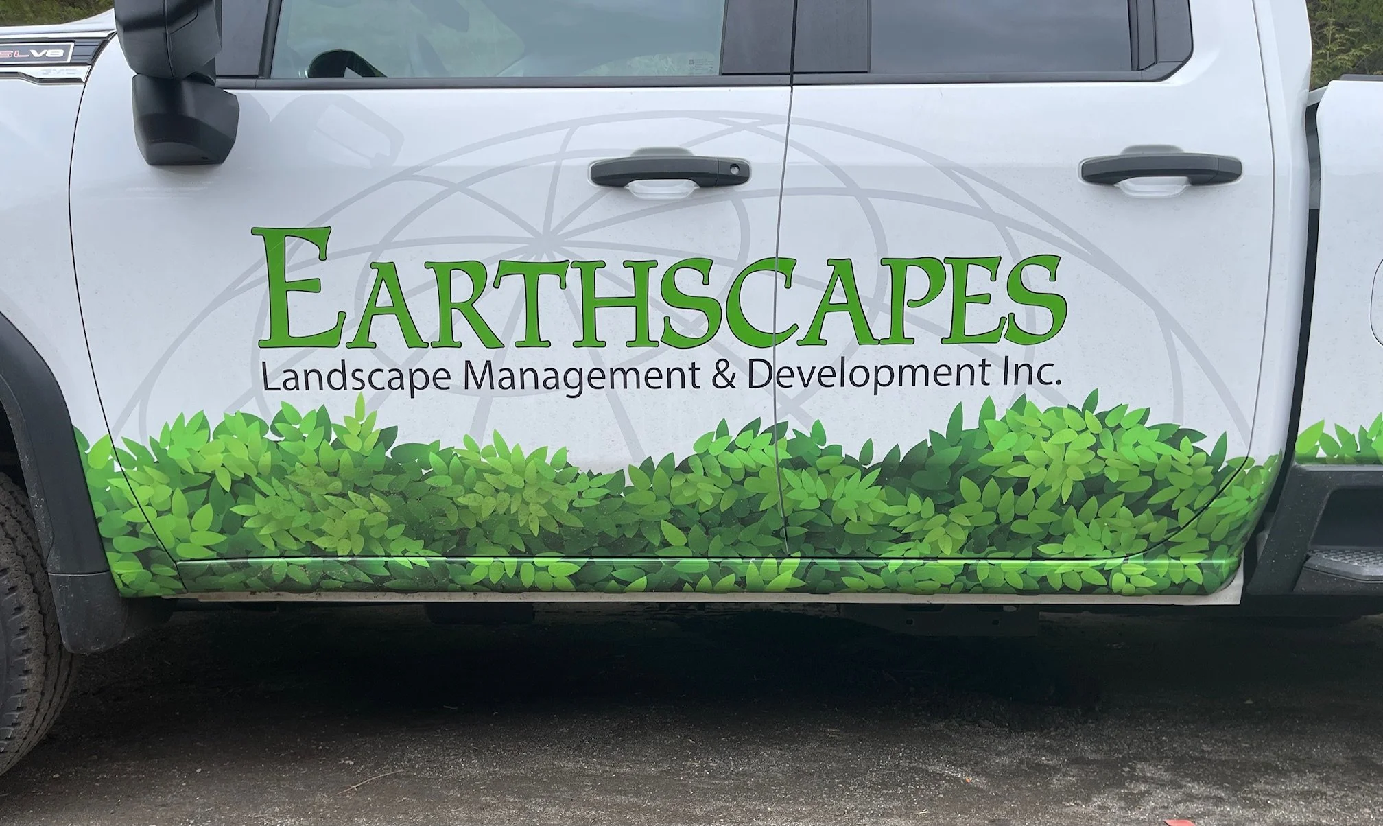 Custom wrapped foliage graphics and 3 layers using green, black and gray 
