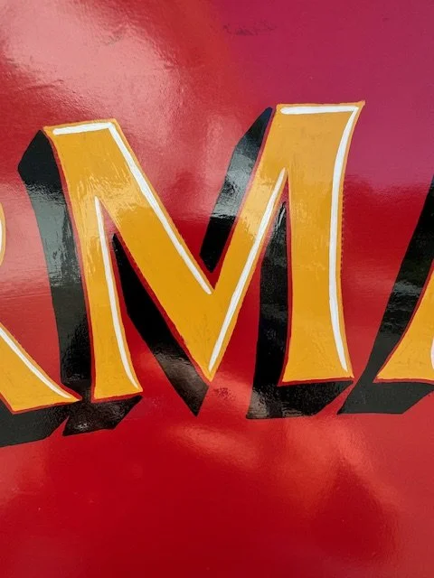 Close up Hand Painted door lettering with black drop shade and white accent details