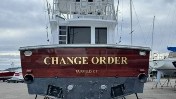 Mahogany Vinyl Wrap transom with 22K Real Gold brand lettering with Black outline
