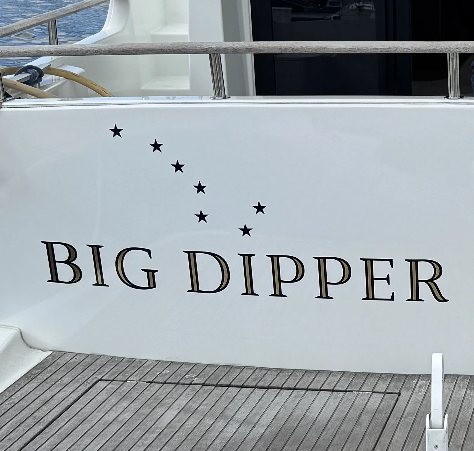 22K Real Gold Burnished lettering accents on dark blue lettering and star graphics 