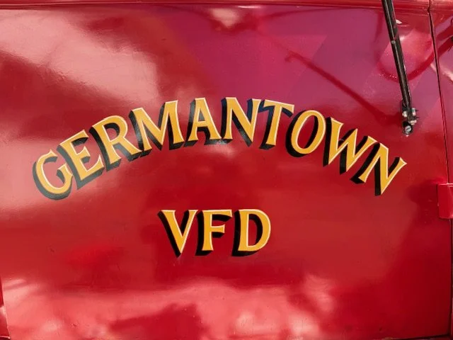 Hand Painted door lettering with black drop shade and white accent details, matching original hood lettering
