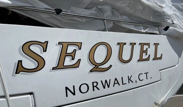 Classic Italic lettering in Gold with Black outline and Gray drop shade