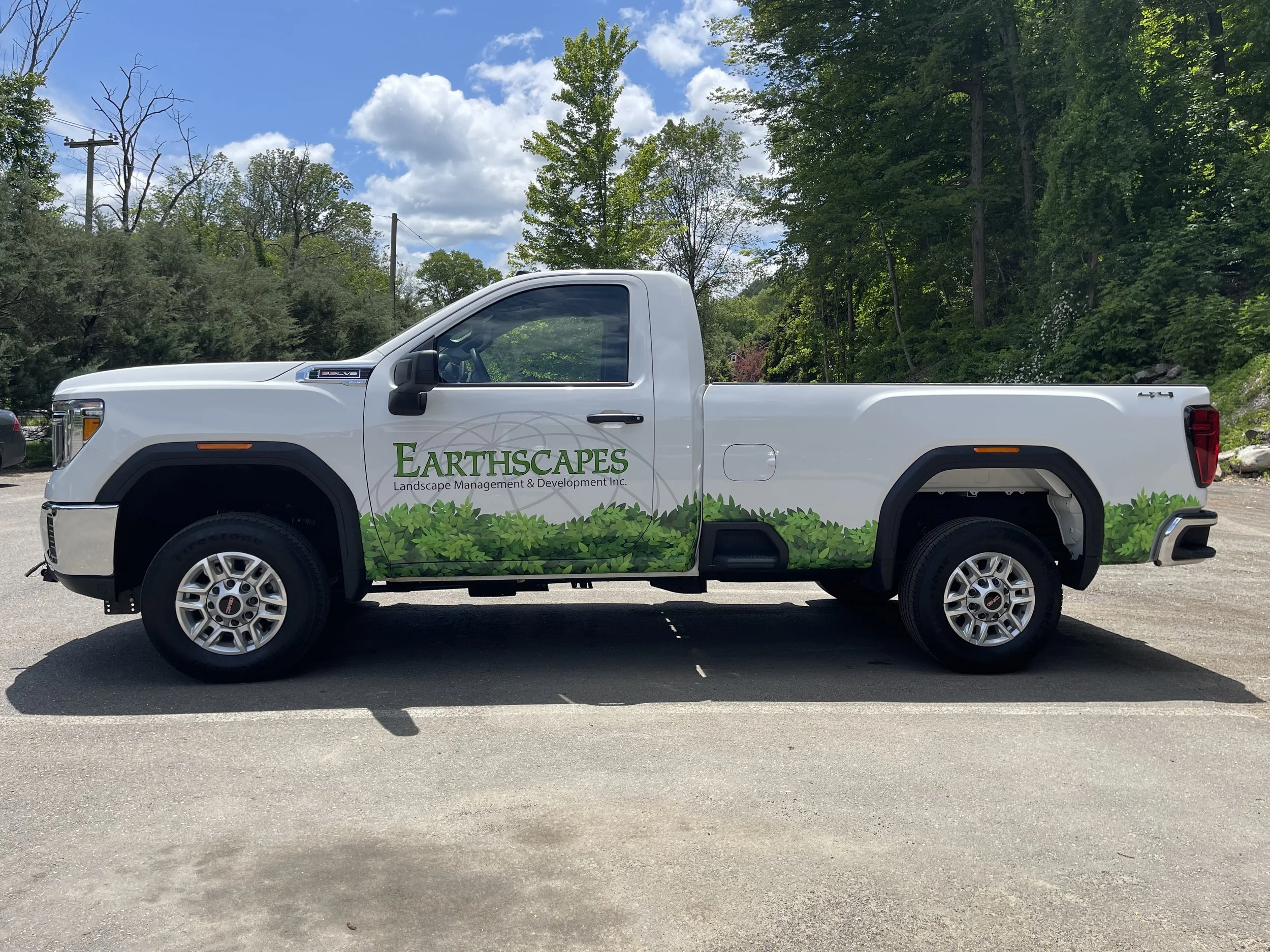 Custom wrapped foliage graphics and 3 layers using green, black and gray 