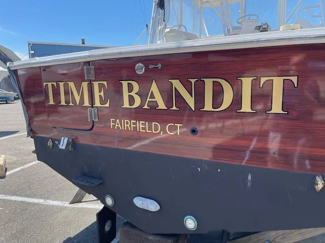 Mahogany Vinyl Wrap transom with 22K Real Gold brand lettering with Black outline