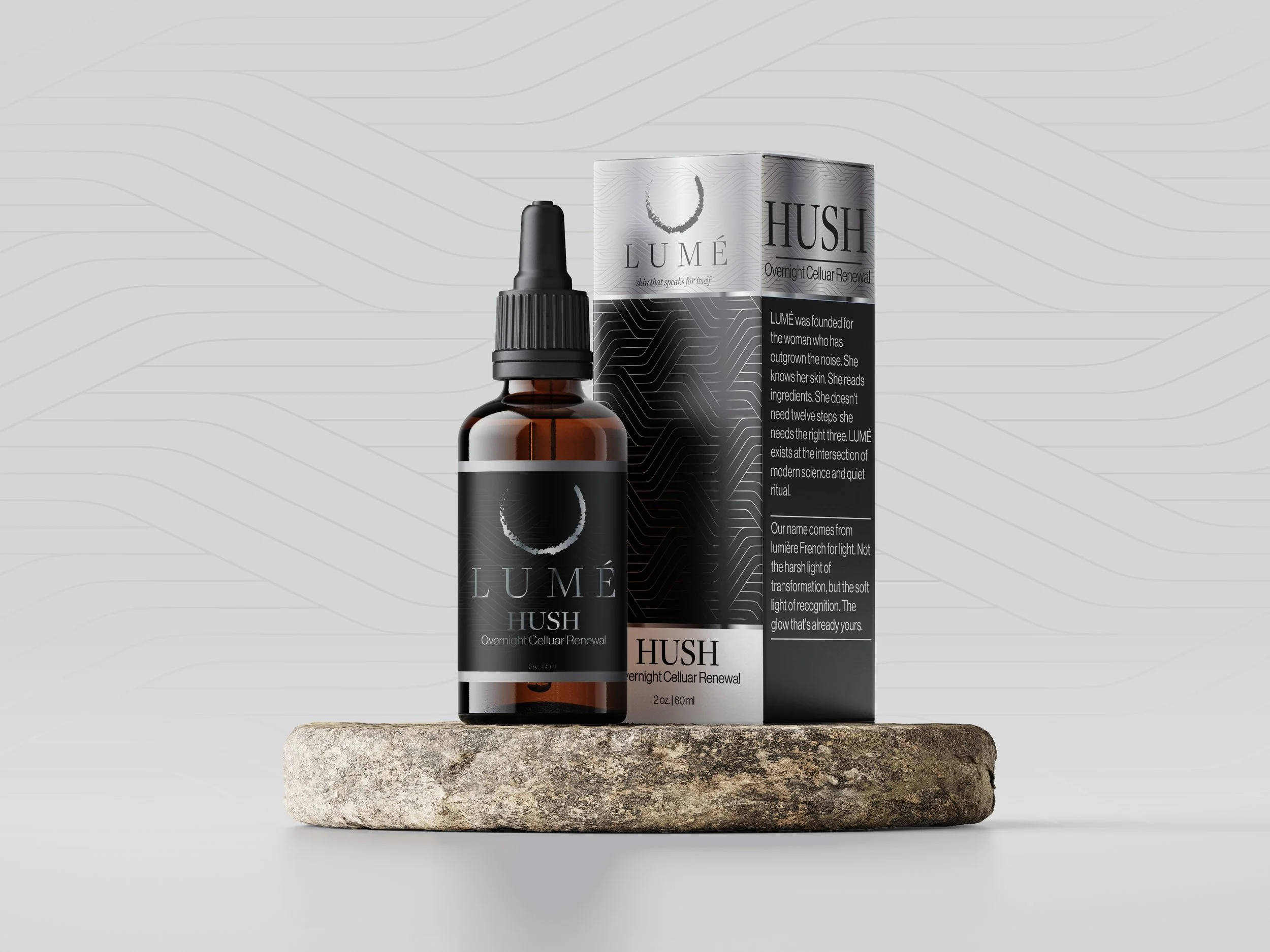 A small dark brown glass bottle with a black dropper cap, labeled 'LUMÉ HUSH Overnight Cellular Renewal', rests on a round stone, with a box behind it that has a similar branding design and description.
