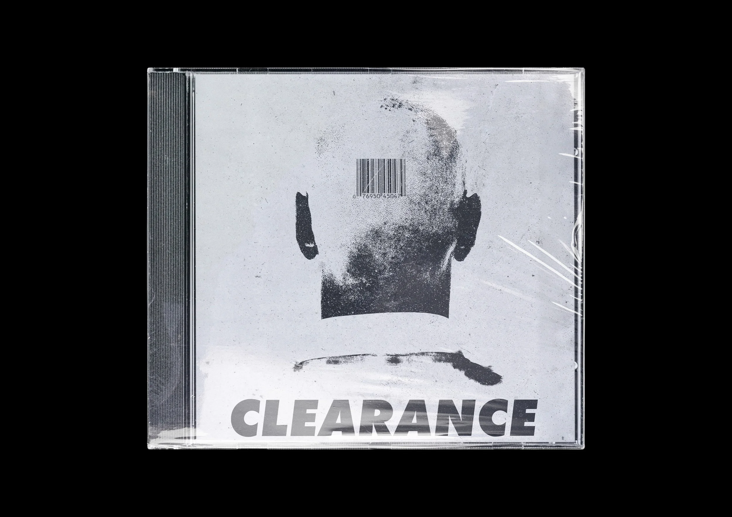 Clearance sign with a microphone image and a barcode in the center, set against a black background.