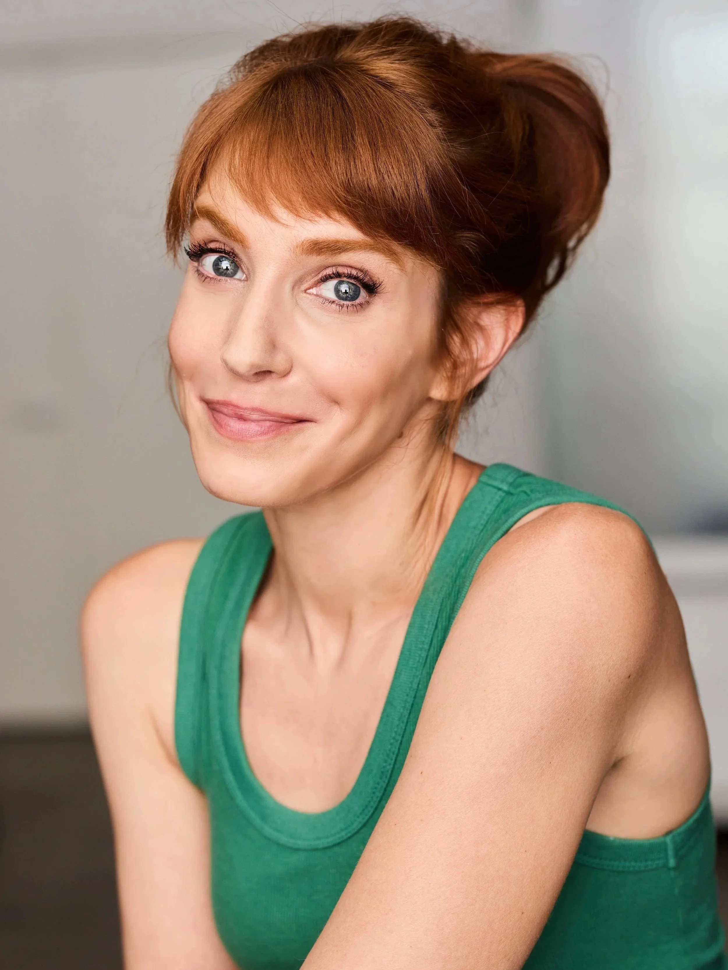 Gwen Hollander, Head of Early Years at Seren Arts Hollywood, smiling in a green top