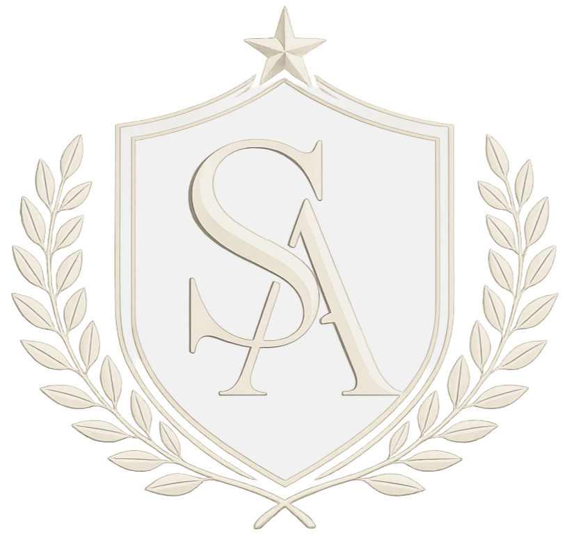 A silver crest featuring a shield with the letters 'S' and 'A' intertwined in the center, topped with a star, and surrounded by a laurel wreath.