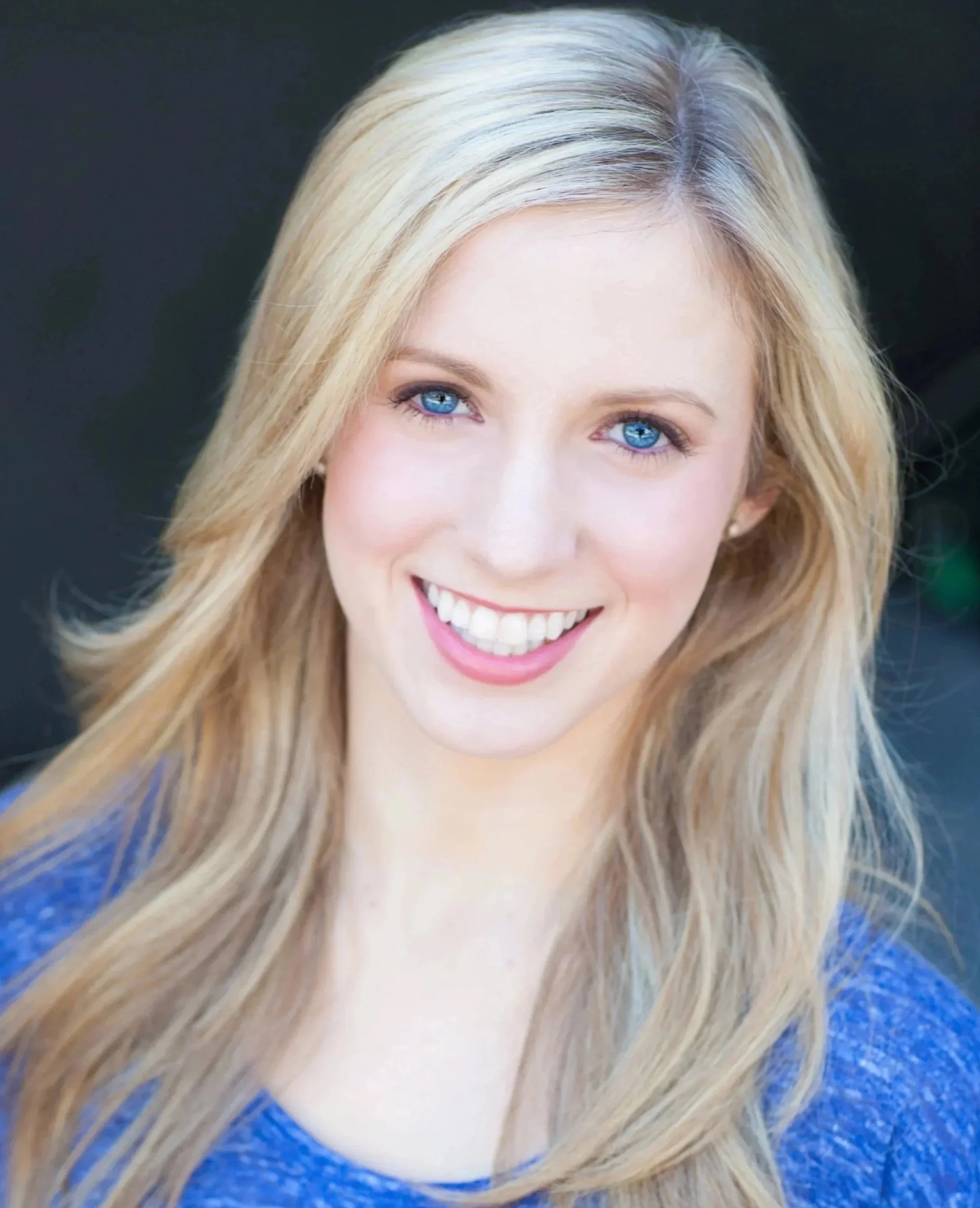 Amanda Carr, Head of Dance & Dramatic Integration at Seren Arts Hollywood, smiling in a blue top