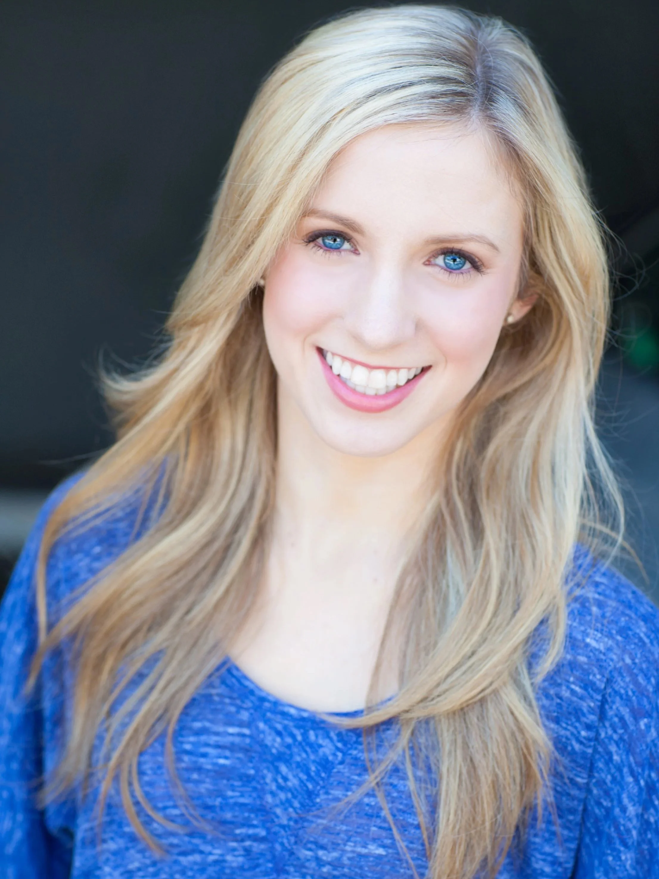 Amanda Carr, Head of Dance & Dramatic Integration at Seren Arts Hollywood, smiling in a blue top