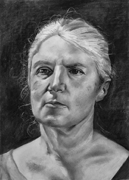A realistic black-and-white portrait of a woman with light hair pulled back, showing a serious expression.