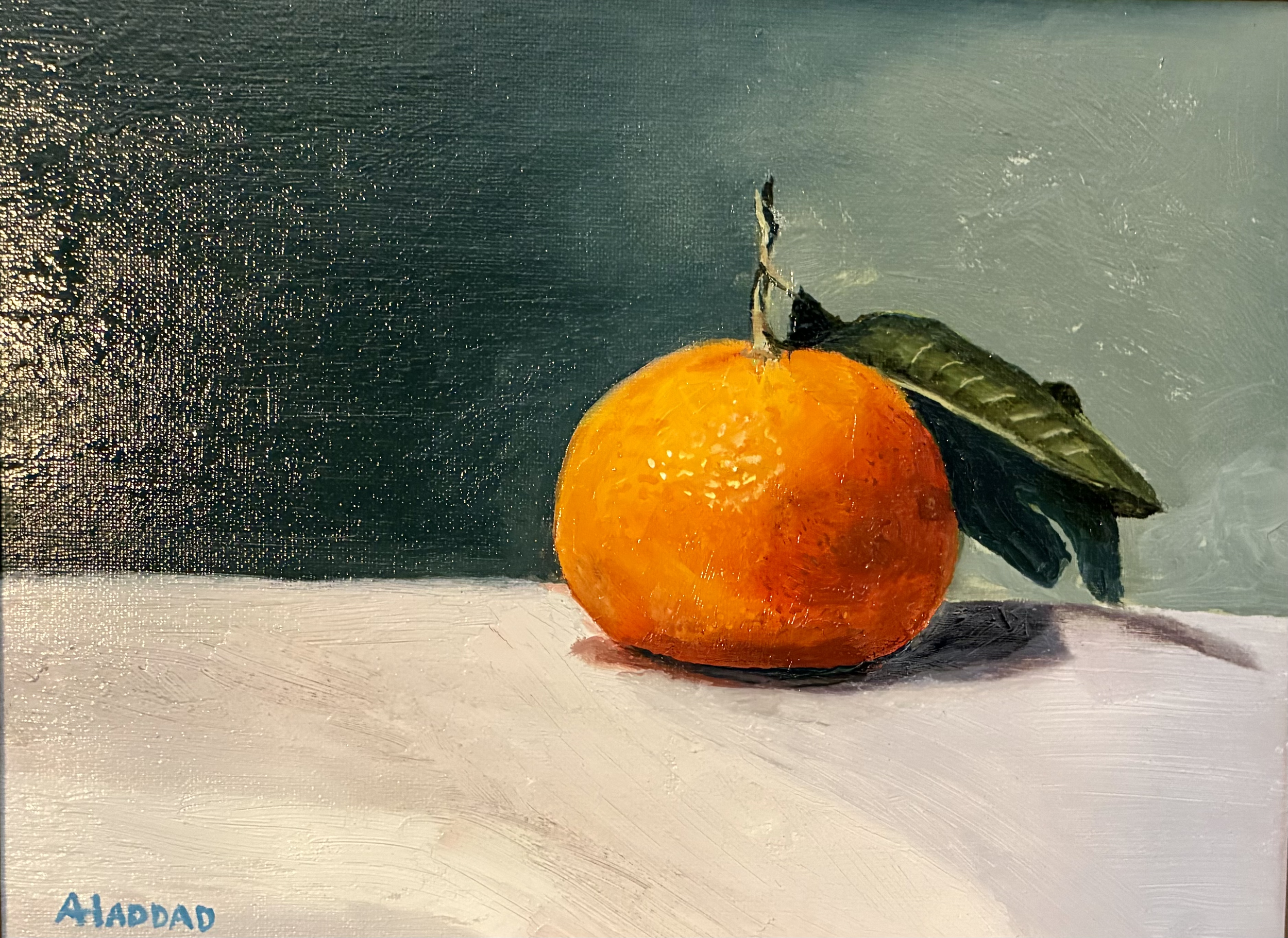 Painting of an orange with a green leaf and brown stem on a white surface, background is a mix of dark blue and light green brush strokes.