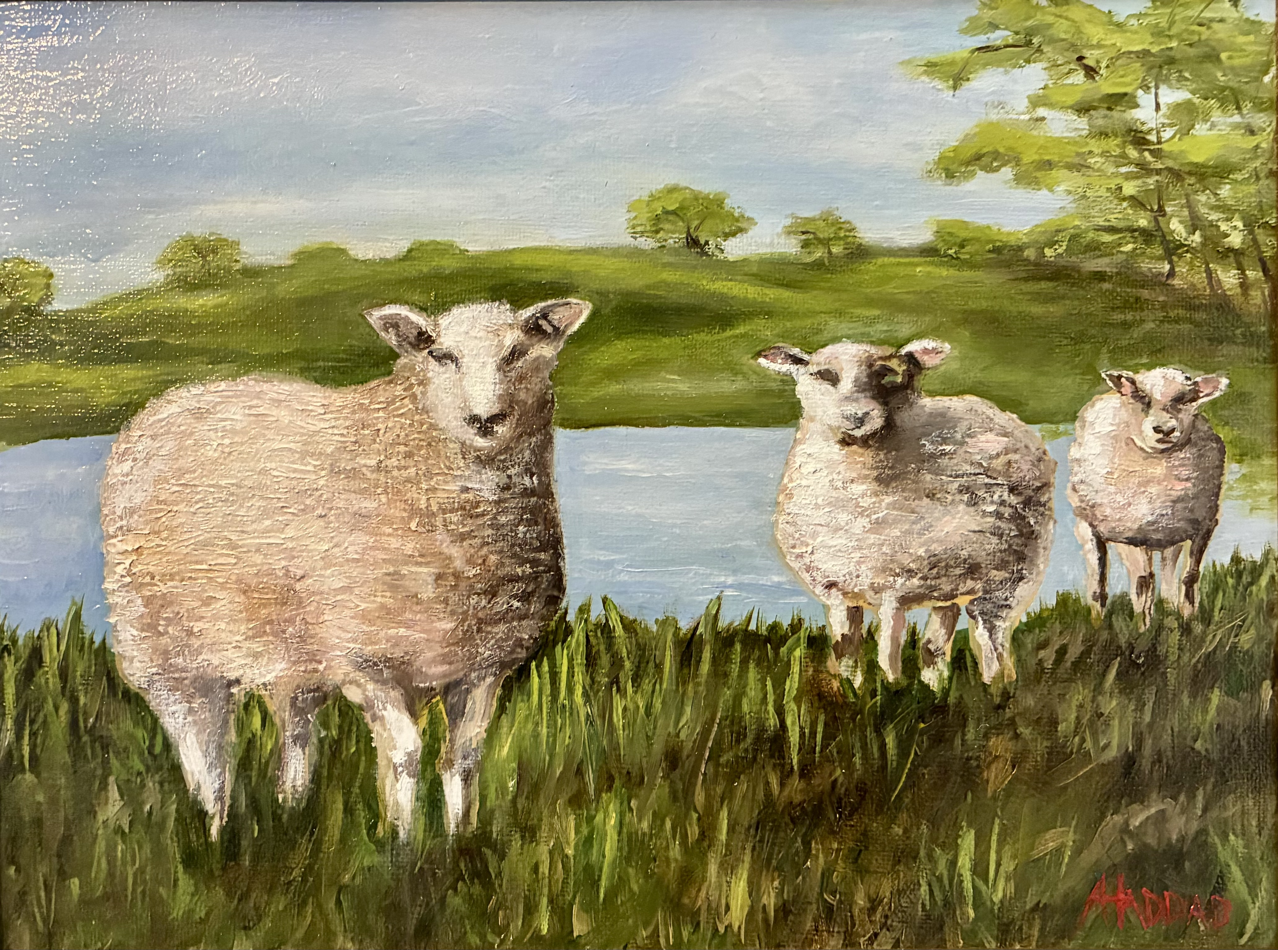 Painting of three lambs standing in green grass near a pond with trees and blue sky in the background.