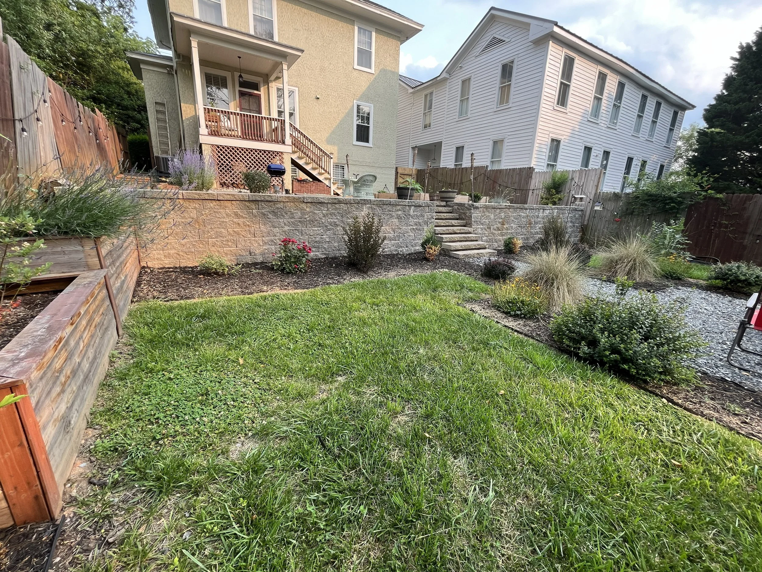 Residential Retaining Wall with Built-In Staircase and Plants