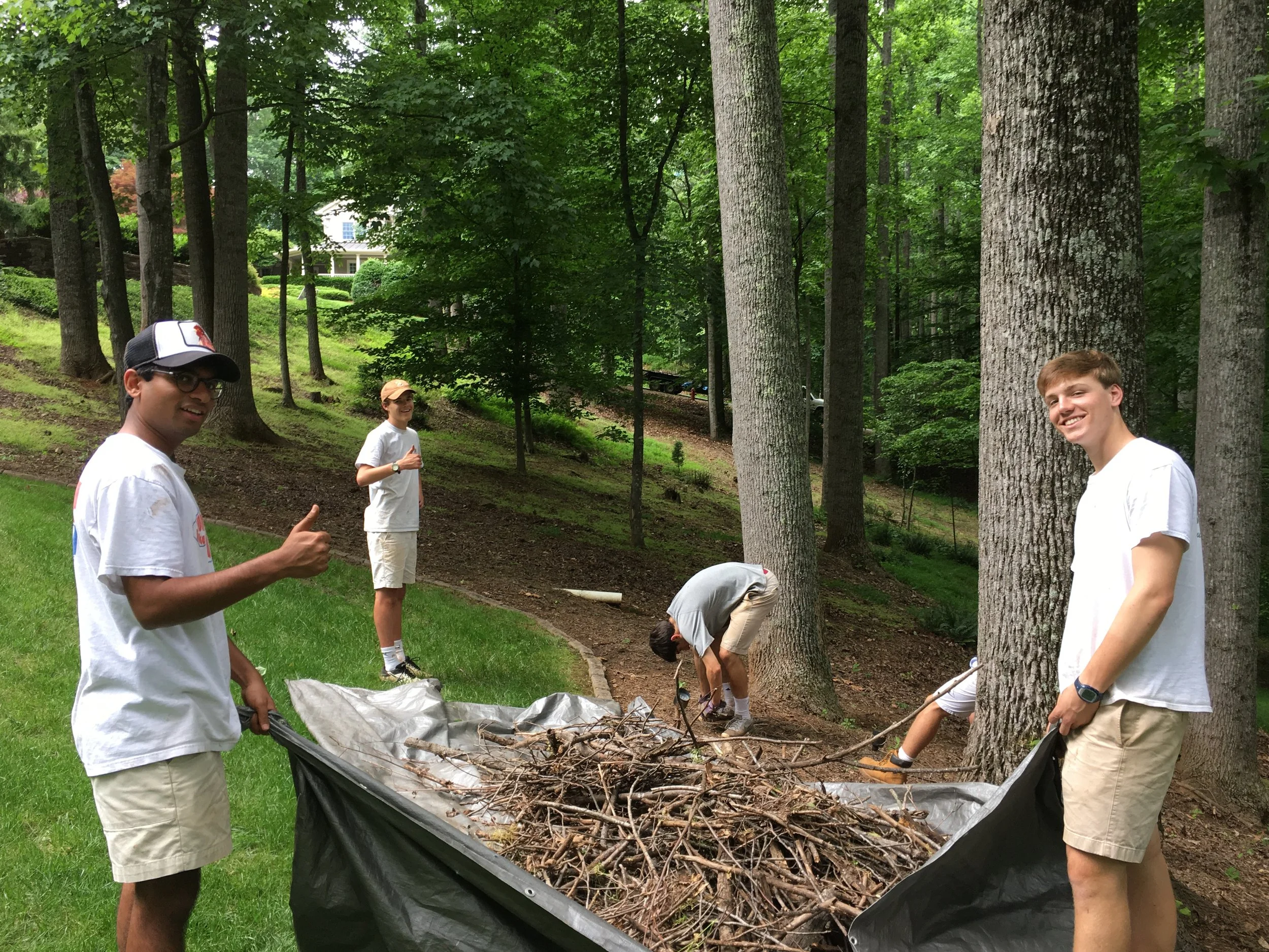Team members doing a residential debris clean-up
