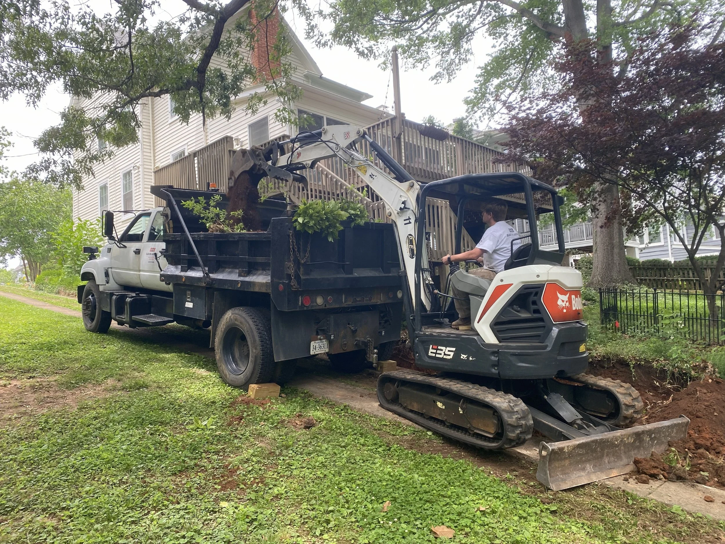 Excavator Loading Dump Truck at Jobsite