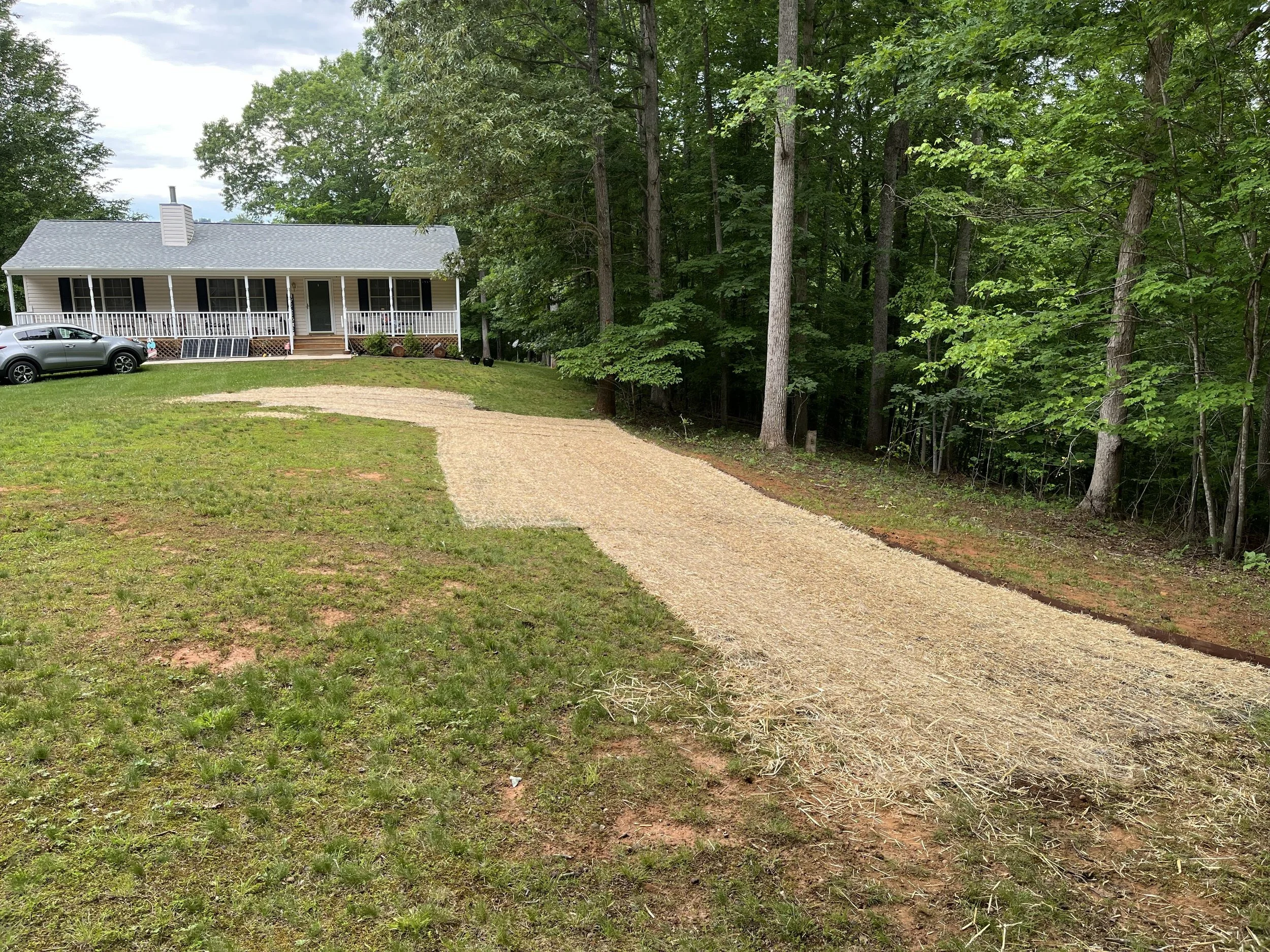 Graded yard with straw and new grass seed