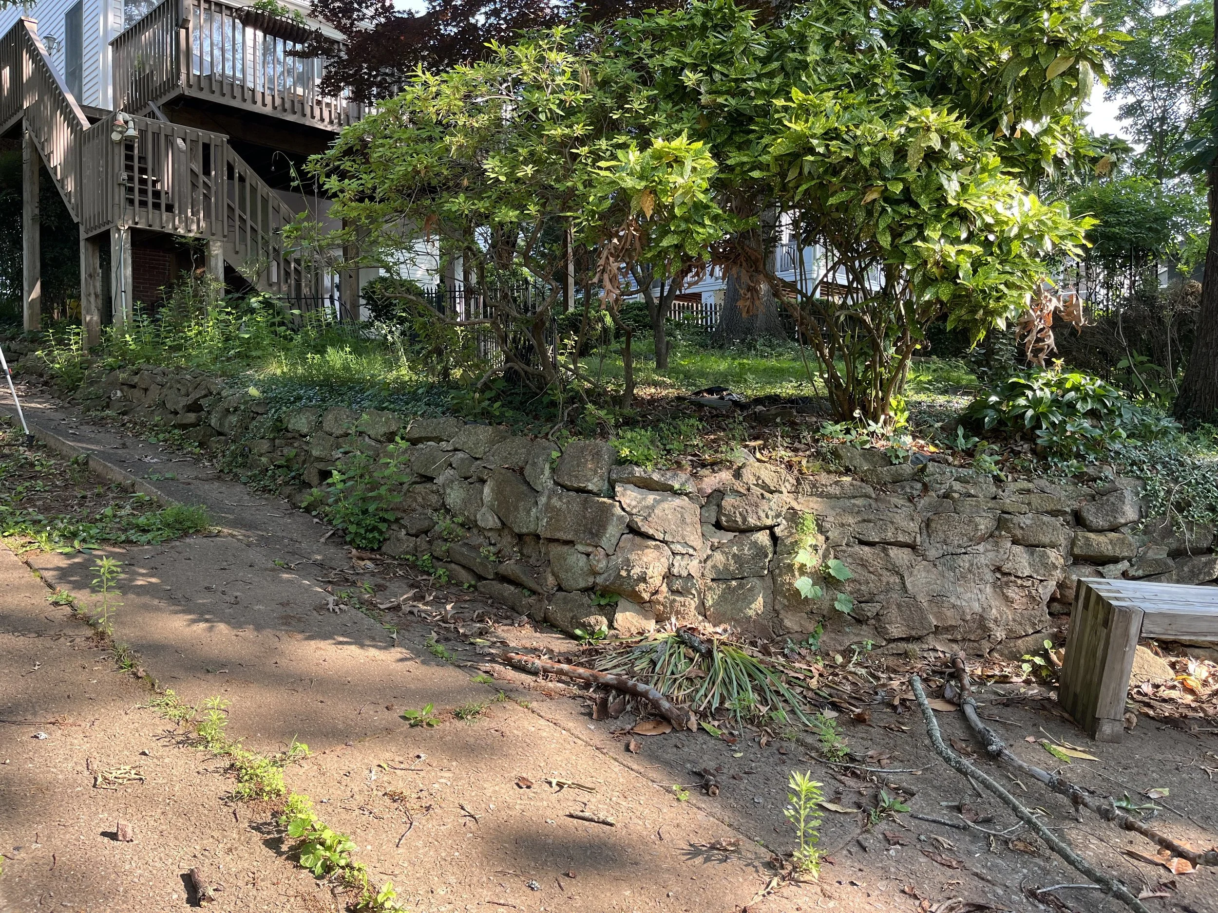 Original photo of old retaining wall in need of replacement