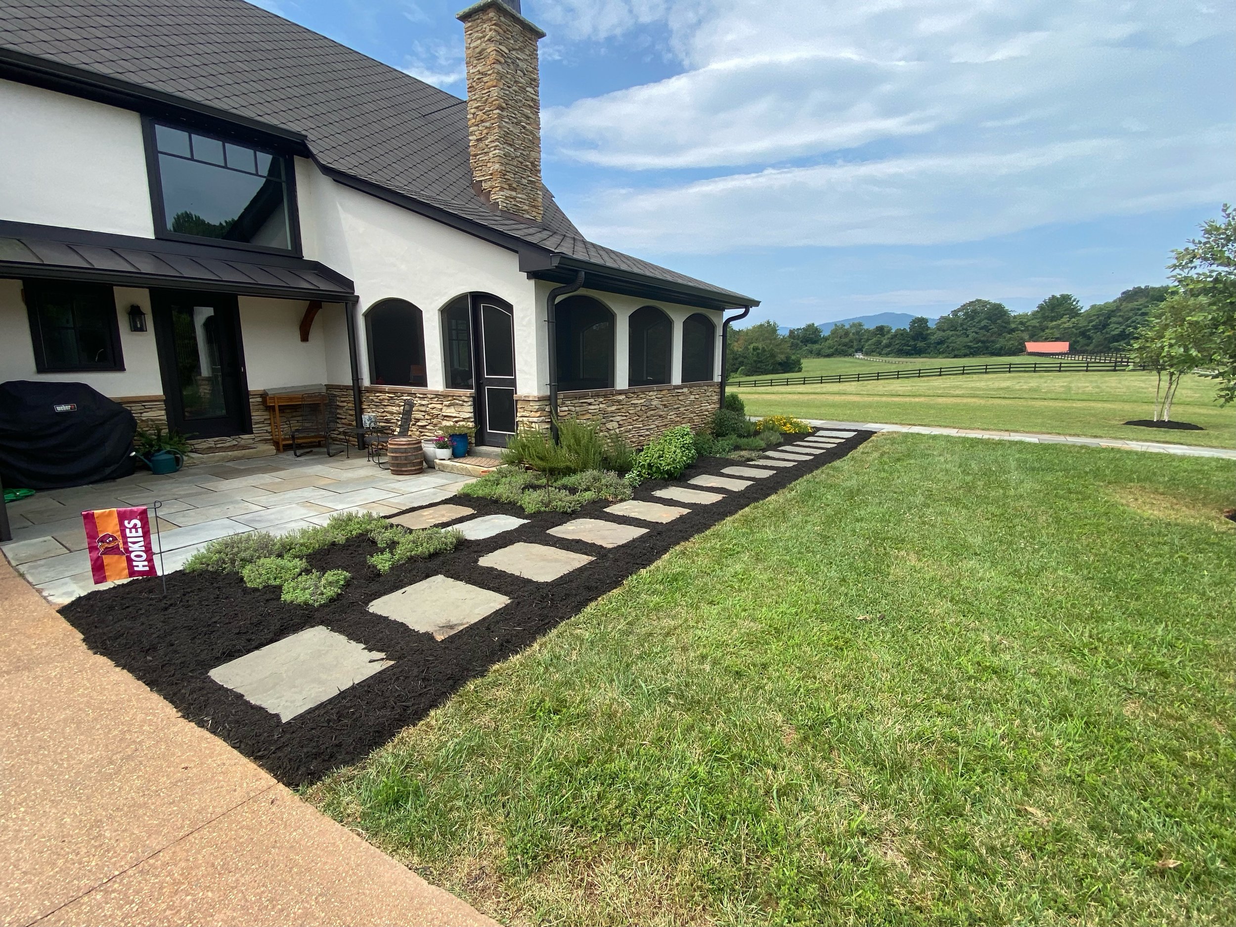 Mulch installation and shrub trimming