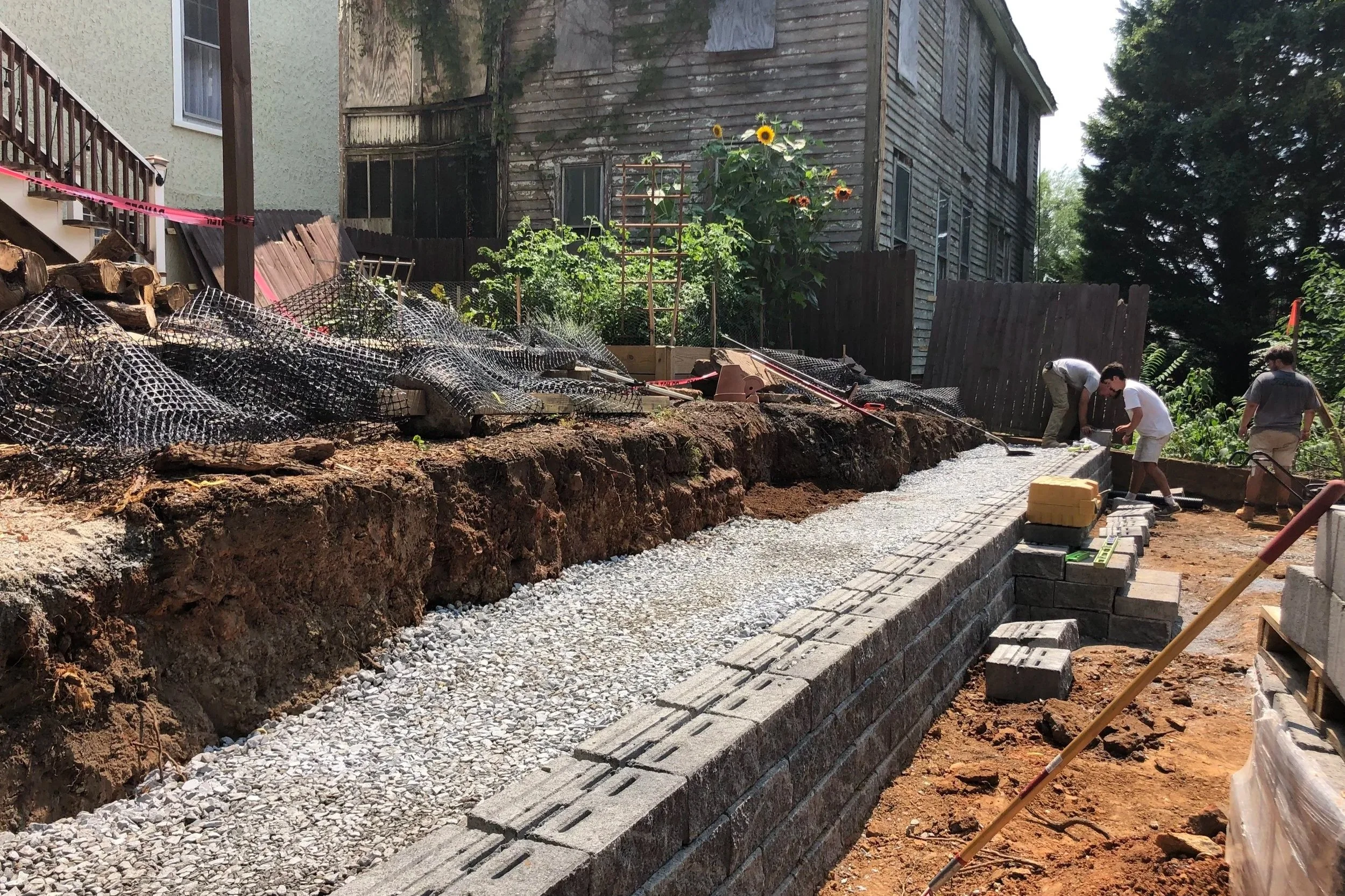 Oakwood landscapes crew constructing new retaining wall