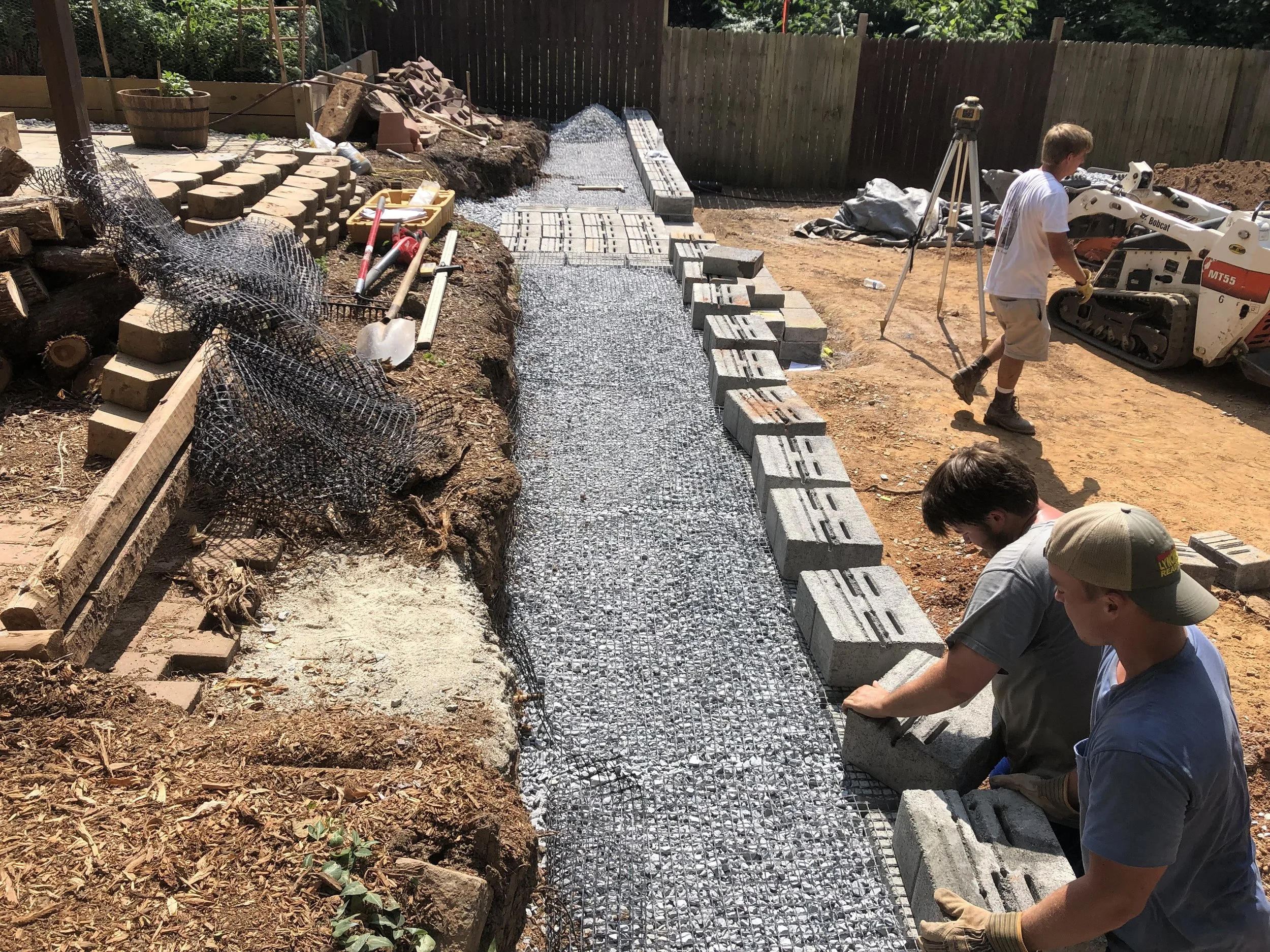 Oakwood Landscapes constructing a new retaining wall