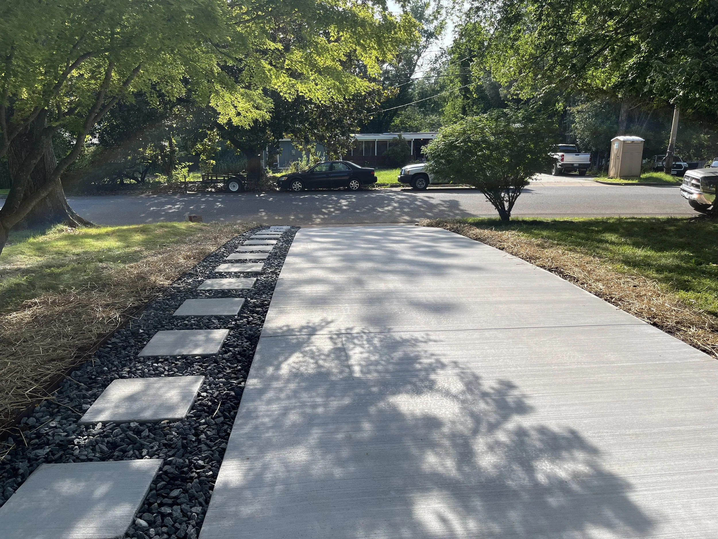 Concrete driveway and stepping stone walkway for large home