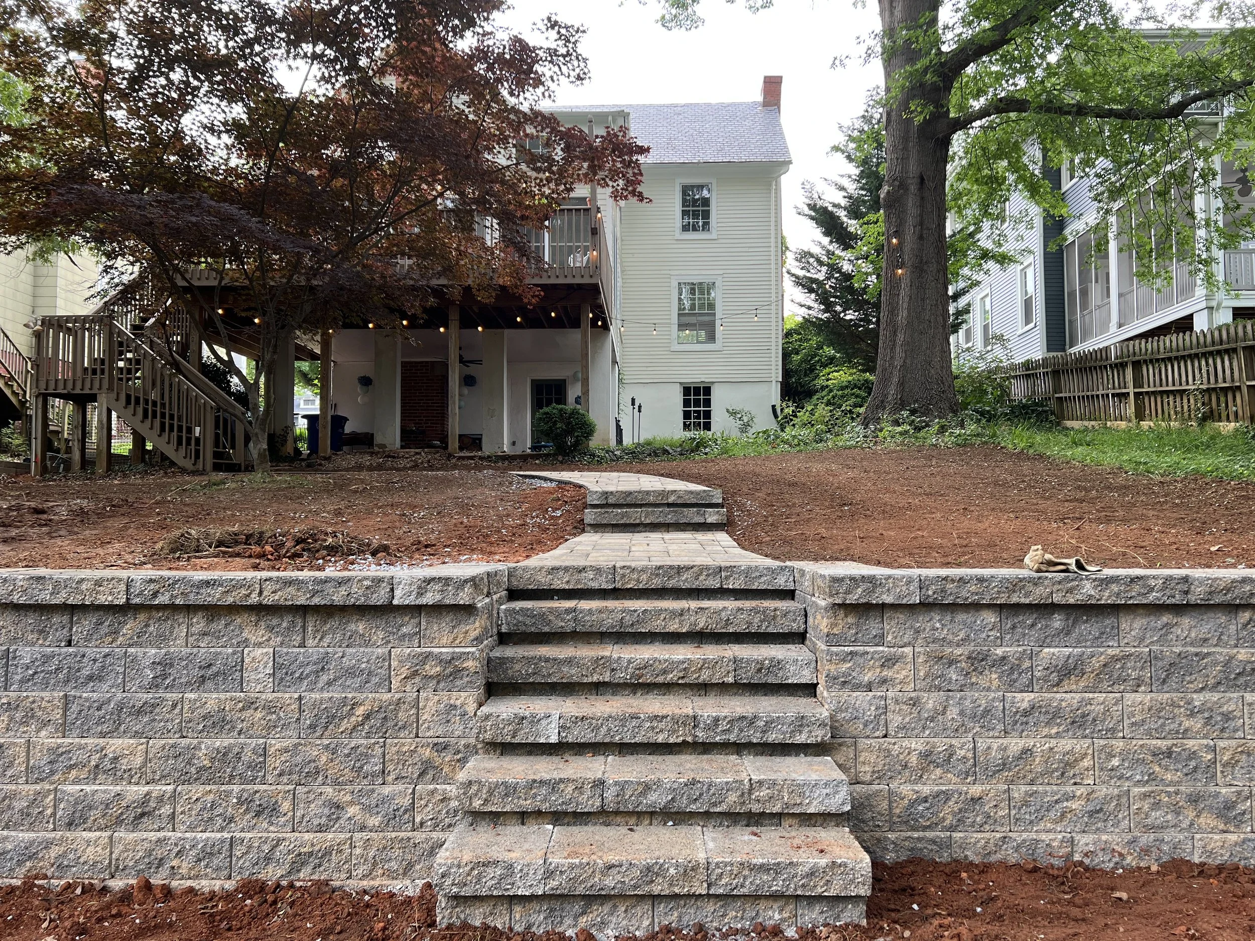 Retaining wall with inset stair construction at a residential home in Richmond.