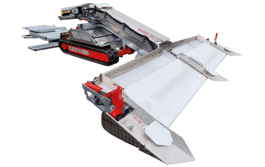 A model robot with metallic and red parts, featuring multiple moving components resembling a futuristic machine or vehicle.
