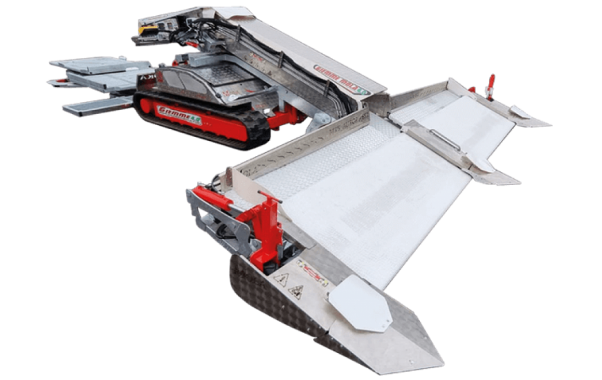 A compact, modular robotic snowplow with a wide metal blade and tracks for maneuvering on snow.