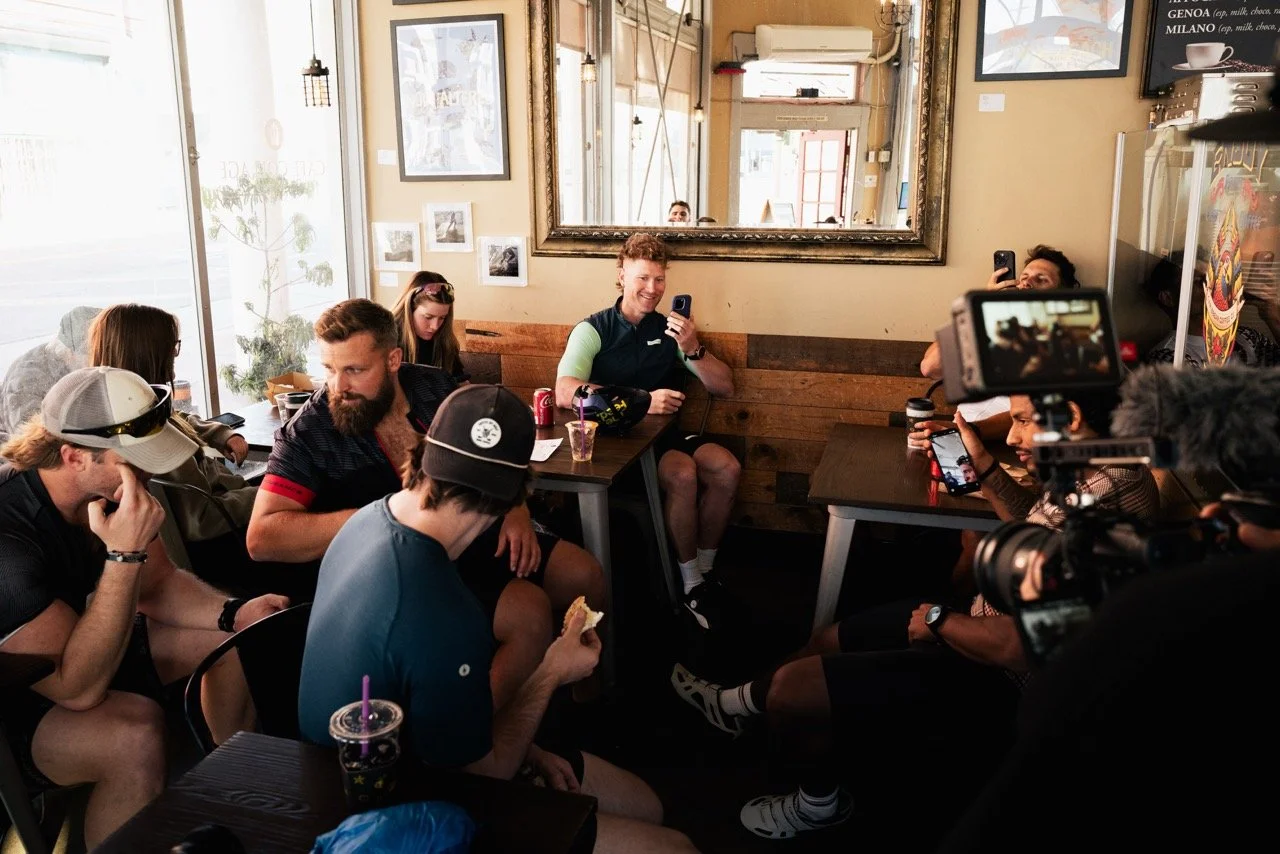 Hunter McIntyre shares his birthday with friends on long bike ride, in cafe
