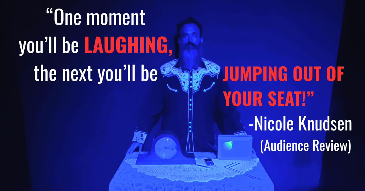 Comedian and director Jon Schnitzer from the paranormal comedy show "Something Spooky" stands at a table of paranormal devices and an old clock. An audience review says, "One moment you'll be laughing, the next you'll be jumping out of your seat!"