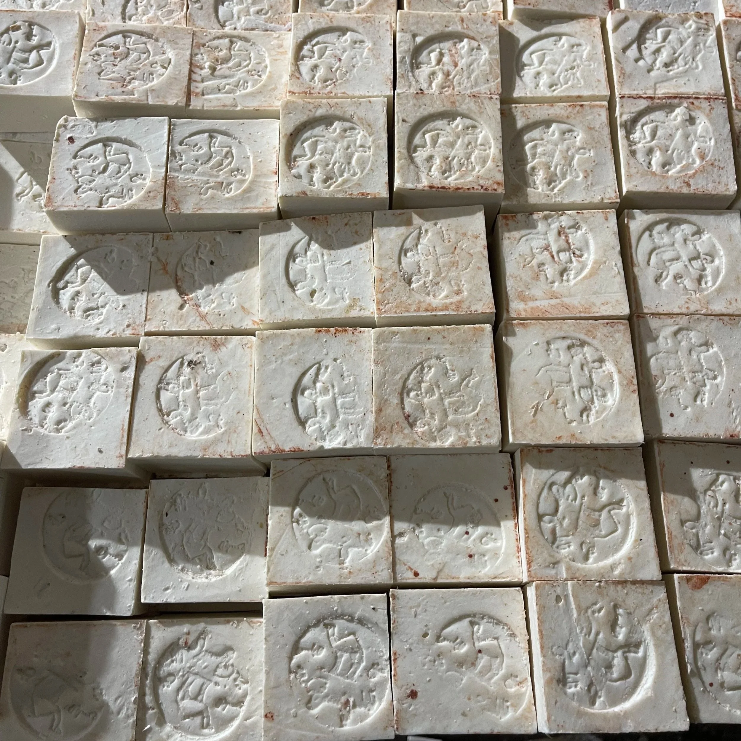 Stacks of Al-Jamal Nabulsi Palestinian olive oil soap bars