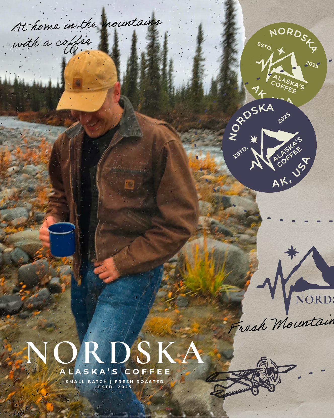 A man smiling, wearing a yellow cap and brown jacket, holding a blue cup, standing outdoors in a rocky, nature setting with pine trees and yellow flowers.