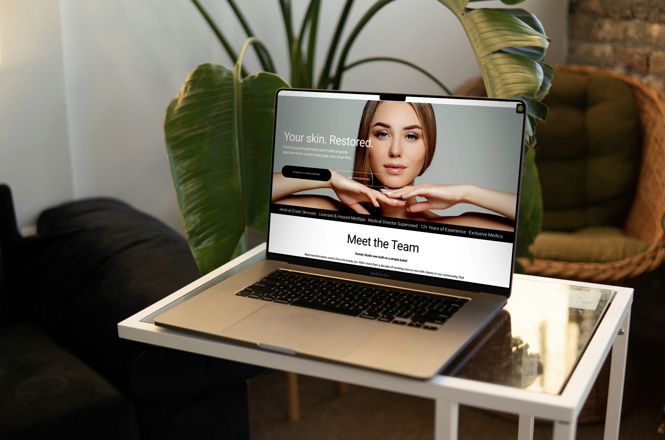 sonias studio website updated by 1110design, shown on a mac laptop in a beautiful high end setting