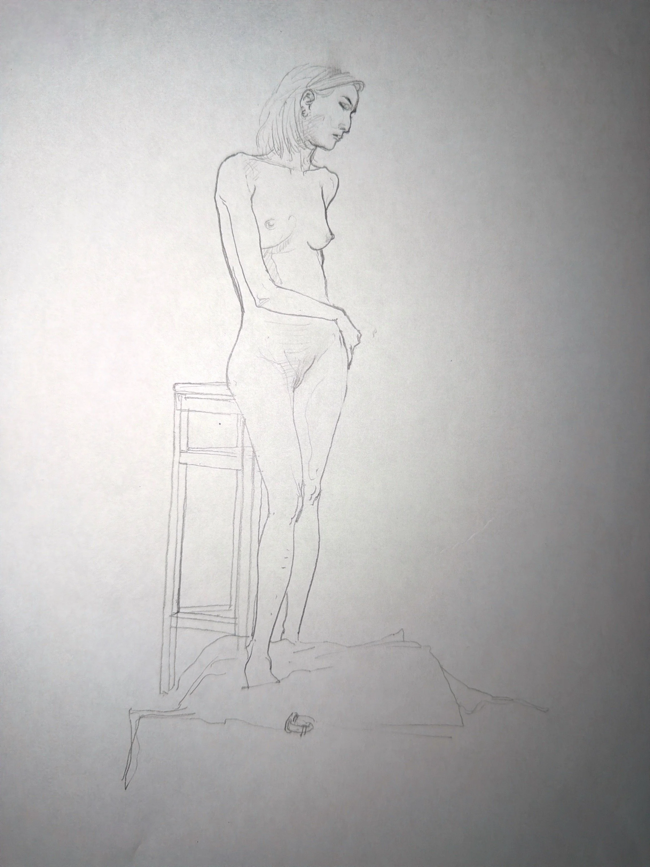 A pencil sketch of a woman standing beside a high chair, with her hand resting on it. The woman has shoulder-length hair and appears to be nude. There is a small object on the floor near her feet.