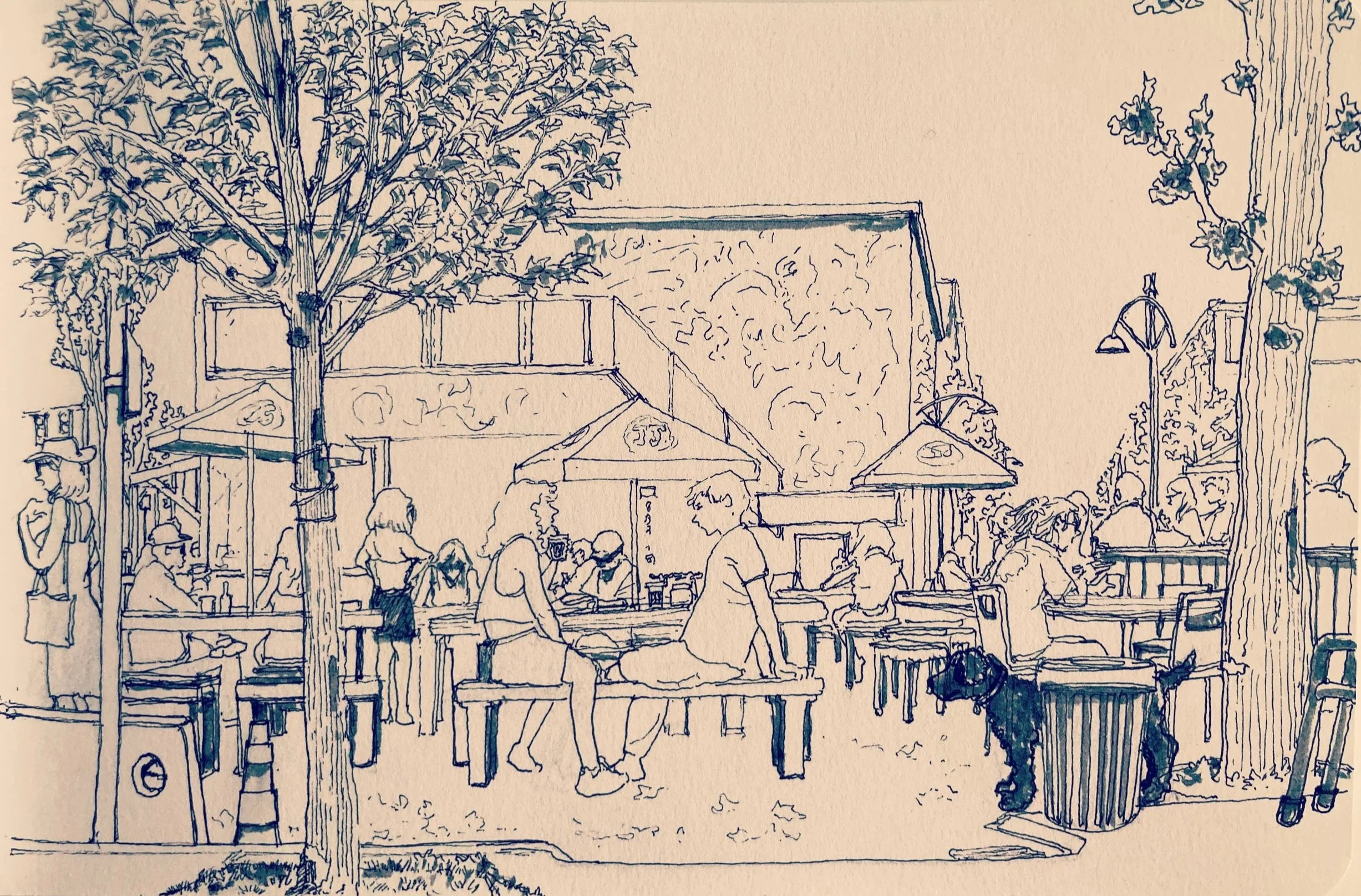 A line drawing of an outdoor scene with people at tables, trees, and a building with a mural on the wall. The scene appears to be a busy outdoor dining or market area.