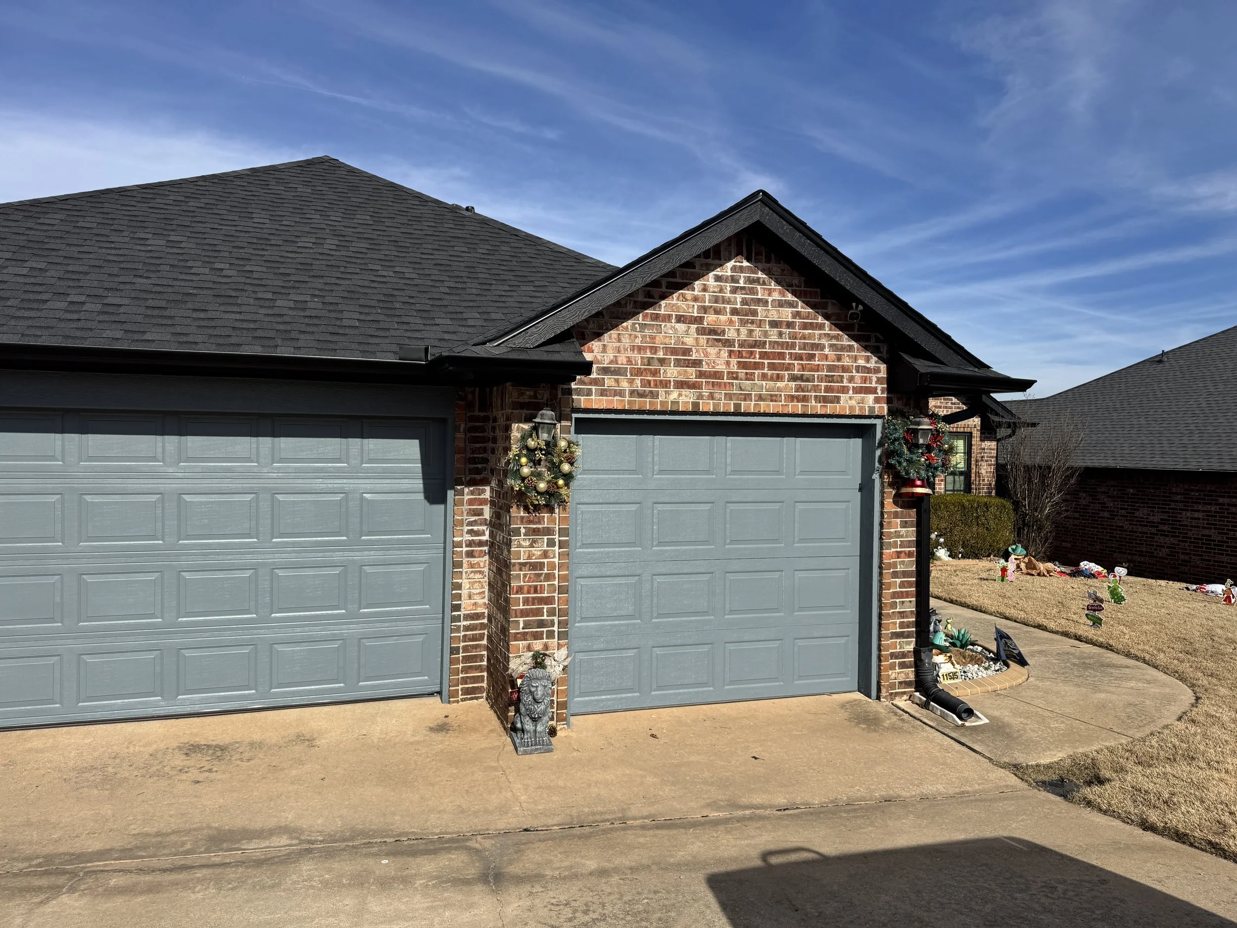 Garage door paint in Midwest City, OK. garage doors painted gray.